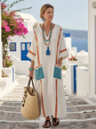 FJØRNA women's summer maxi dress with V-neck and short sleeves, flowing lightweight fabric perfect for warm weather.