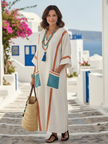 Flowy summer maxi dress for women by FJØRNA with pockets, featuring a relaxed fit and lightweight fabric in a stylish design.