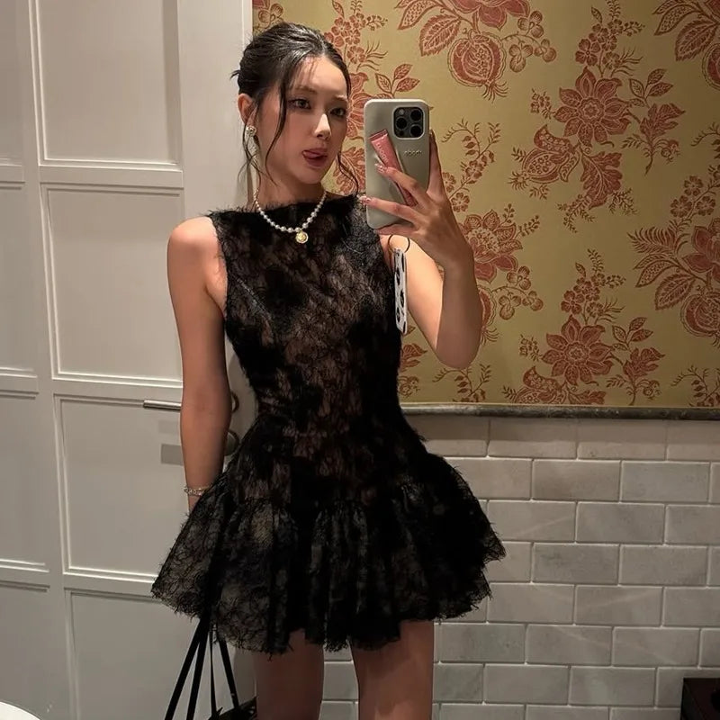 FJØRNA women's tulle back bow dress in mini, midi, or maxi length, featuring a delicate tulle fabric and elegant bow detail.