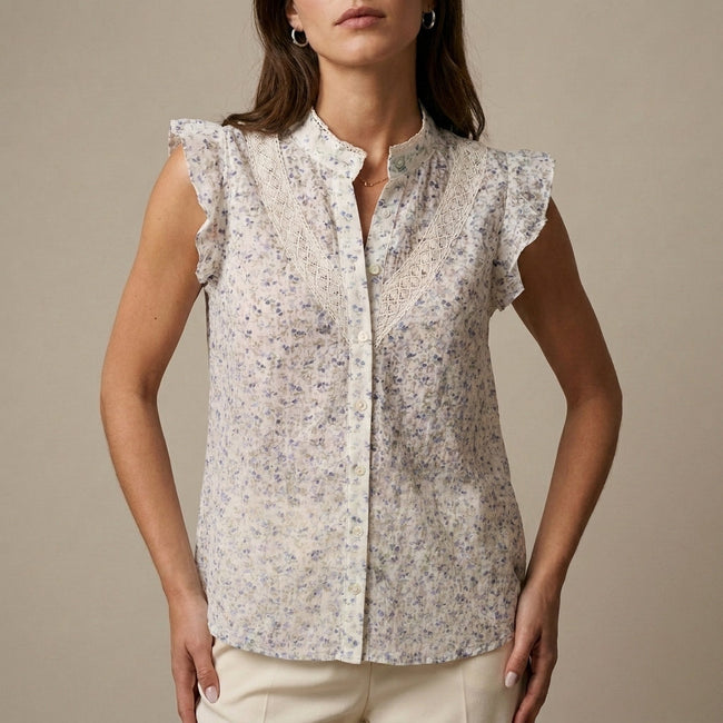 FJØRNA women's floral sleeveless summer blouse displayed untucked, lightweight and stylish for warm weather.
