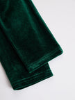 FJØRNA velvet midi evening dress showing a fitted silhouette with long sleeves and a elegant neckline.