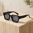 FJØRNA vintage 90s rectangular unisex sunglasses with retro style, black frame and dark lenses, accessory for women.