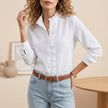 White linen ruffle trim blouse for women by FJØRNA, featuring a stylish and breathable top with delicate ruffle details.