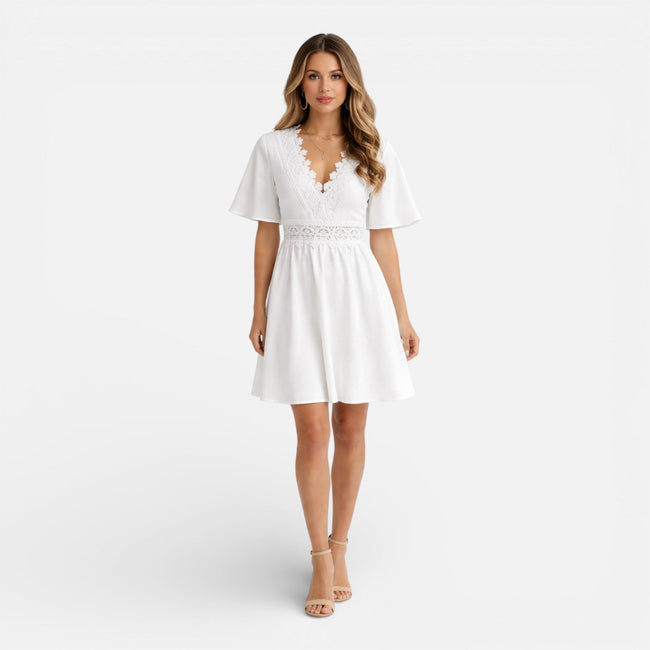 Women's white lace summer dress by FJØRNA featuring a V-neck and A-line silhouette, perfect for wedding guest attire.