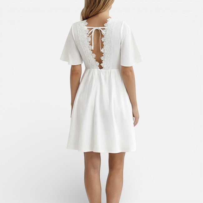 Women's white lace summer dress by FJØRNA featuring a V-neck, A-line silhouette, perfect for wedding guest occasions.