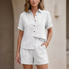 White FJØRNA women's two-piece co-ord set with button-front top and matching lightweight pants, stylish and comfortable for casual wear.