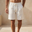 White men's quick-dry above-the-knee swim shorts by FJØRNA, relaxed fit, suitable for summer beach and pool activities.