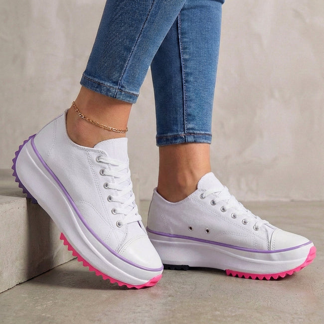 White FJØRNA women's orthopedic lace-up sneakers with supportive design, ideal for comfortable everyday walking.