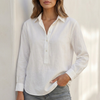 White linen V-neck popover blouse for women, relaxed fit top by FJØRNA, featuring a classic collar and lightweight fabric.