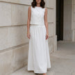 White FJØRNA two-piece women's co-ord set with a slit design, stylish and elegant for casual or semi-formal wear.