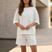 White FJØRNA women's summer two-piece set with pockets, lightweight co-ord matching outfit, casual and comfortable for warm weather.