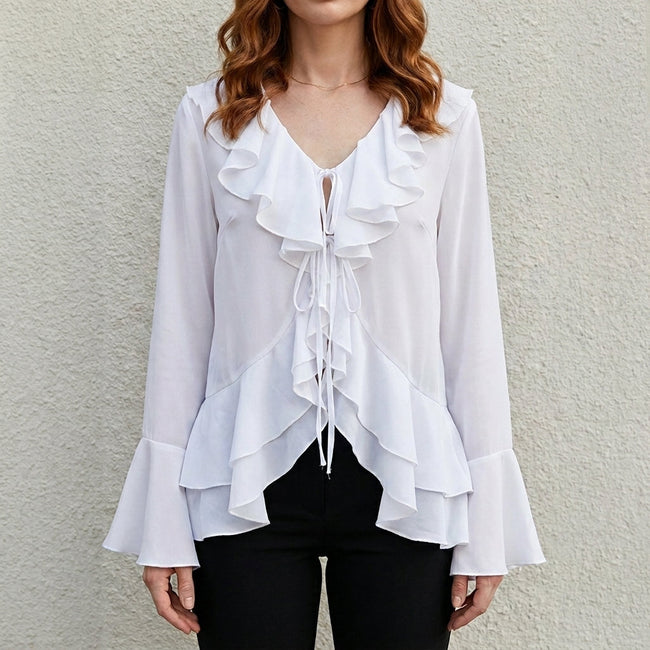 White women's summer blouse with bell sleeves and denim fabric by FJØRNA, featuring a relaxed fit and stylish design.