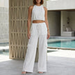 White women's summer two-piece co-ord set with pockets and halter neck by FJØRNA, perfect for warm-weather casual wear.