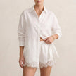 White FJØRNA elegant two-piece lace co-ord set for women, featuring a stylish crop top and matching high-waisted skirt.