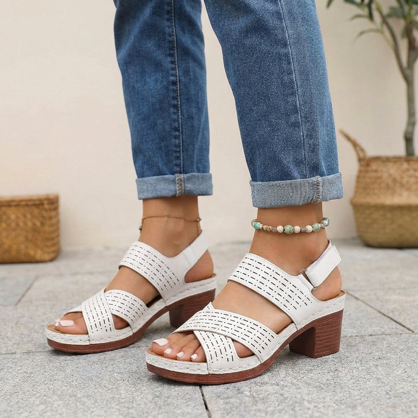 FJØRNA white orthopedic platform block heel sandals with open toe and cut-out design, showcasing stylish and supportive footwear.