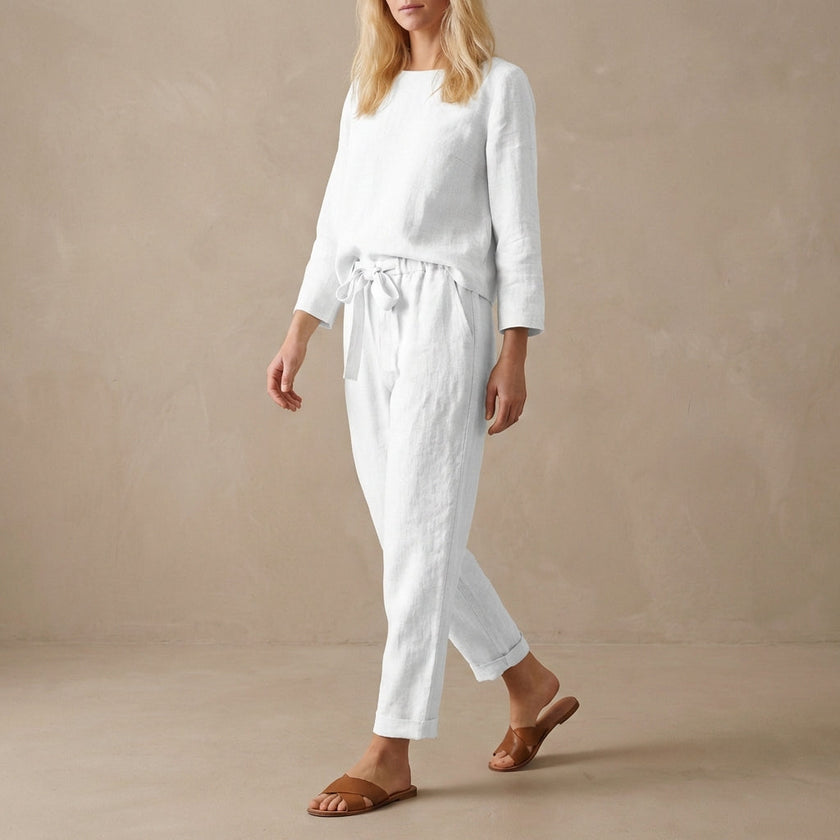 White linen two-piece women's co-ord set with pockets by FJØRNA, featuring a stylish and comfortable casual outfit.