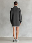 White knit mini dress for women by FJØRNA, featuring a fitted silhouette and long sleeves, styled with a cozy, soft texture.