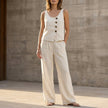 White summer two-piece co-ord set for women by FJØRNA featuring a casual matching top and pants with pockets.