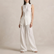 White FJØRNA women's two-piece co-ord set with an asymmetric high neck, featuring a stylish and elegant design.