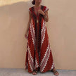 Wine red FJØRNA women's maxi dress with geometric V-neck design, flowing fabric and elegant silhouette.