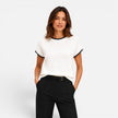 Women’s FJØRNA contrast trim knit top with short sleeves and crew neck, showcasing a stylish, casual women’s shirt.