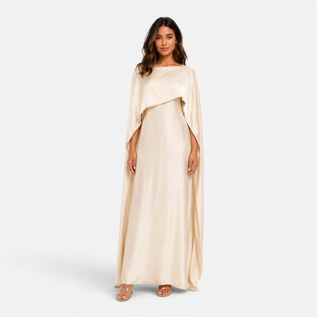 Women wearing FJØRNA women's draped sleeve maxi dress featuring flowing fabric and elegant design, full-length view.