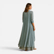 Women’s floral embroidered maxi dress with chiffon jacket set by FJØRNA, featuring delicate embroidery and flowing fabric.