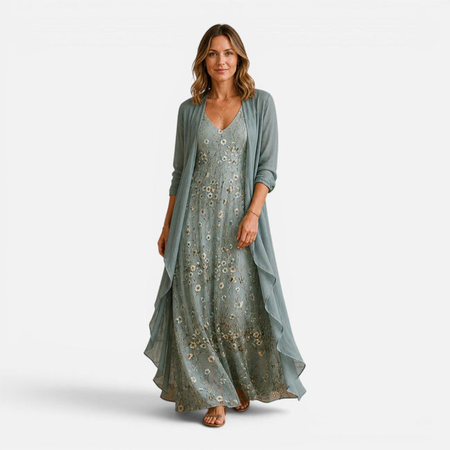 Women wearing a floral embroidered maxi dress with a matching chiffon jacket, stylish and elegant outfit by FJØRNA.