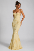 Elegant women's floral embroidered corset maxi dress by FJØRNA, featuring a sculpted silhouette and intricate floral embroidery.