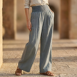 Women’s high waist wide-leg trousers by FJØRNA, white summer pants with elastic waistband and flowing fit.