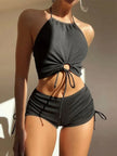 FJØRNA women's halter neck 2-piece bikini set with ring detail and ruched tie side shorts, perfect for beach or poolside wear.