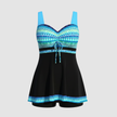 Women's nautical print swim dress by FJØRNA featuring a fitted bodice and skirted hem for beach and poolside wear.