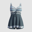 Women's FJØRNA nautical print swim dress with bodice and skirted hem, perfect for beach or poolside wear.