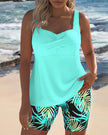 FJØRNA women's tummy control tankini with printed bottoms, featuring supportive design and vibrant floral pattern.