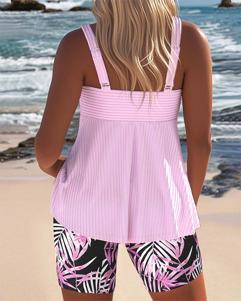 FJØRNA women's tummy control tankini with printed bottoms, featuring supportive fit and colorful swimwear design.