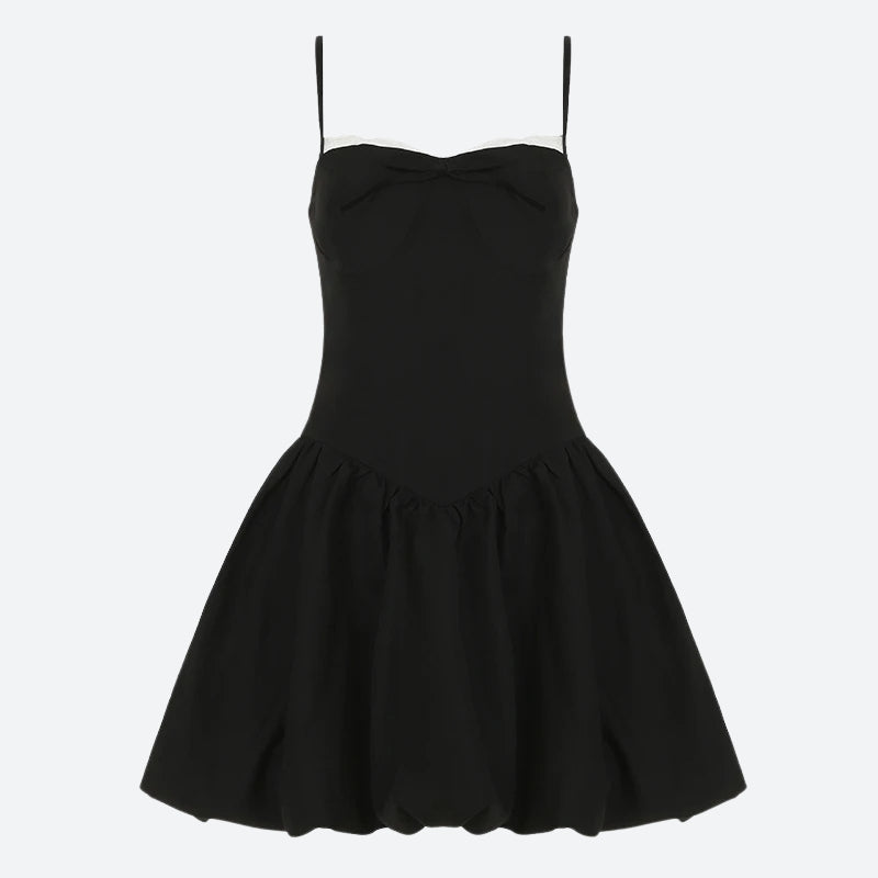 FJØRNA Y2K Bow Bubble mini dress featuring a playful bow design, ideal for party and daytime wear, shown on a model.