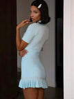 FJØRNA Y2K ribbed women's mini dress with long sleeves, fitted style, suitable for party and daytime wear, shown on a hanger.
