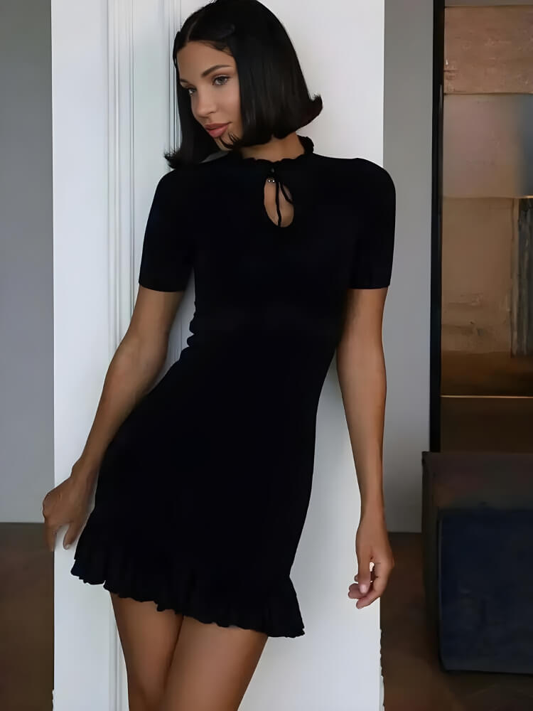 FJØRNA Y2K ribbed women's mini dress featuring a fitted silhouette, perfect for party and daytime wear, shown in a stylish design.