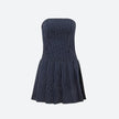 FJØRNA Y2K striped strapless mini dress with bold pattern, perfect for party or daytime wear.