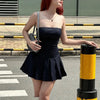 FJØRNA Y2K striped strapless mini dress for women, featuring bold horizontal patterns, perfect for party and daytime wear.