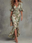 FJØRNA Kassy White Dress, a long elegant dress with flowing fabric, perfect for formal occasions, shown in the image.