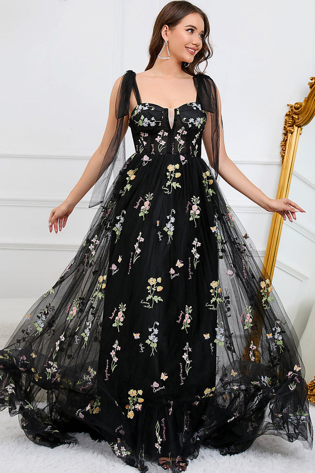 FJØRNA Macy trendy tulle A-line evening dress in black, featuring elegant flowing fabric and a stylish silhouette.