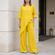 Yellow women's summer two-piece co-ord set with asymmetric design, from FJØRNA, featuring a stylish and comfortable matching top and bottom.