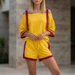 Yellow FJØRNA women's summer two-piece co-ord set with drawstring off-shoulder top and matching shorts.