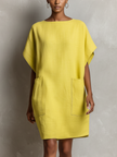 FJØRNA yellow linen dress for women, flowy summer dress with short sleeves and a relaxed fit, perfect for warm weather.