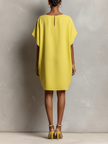 Yellow linen dress for women by FJØRNA, featuring a flowy sleeveless design with a relaxed fit and lightweight fabric.