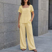 Yellow FJØRNA women's summer two-piece co-ord set with relaxed fit and wide-leg pants, perfect for casual warm-weather wear.