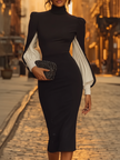 White FJØRNA midi dress for women, showcasing a flowing fabric and elegant knee-length design on a woman modeling the dress.