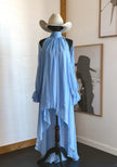 FJØRNA halter neckline sleeveless asymmetric maxi dress with flowing fabric and elegant design, perfect for summer occasions.