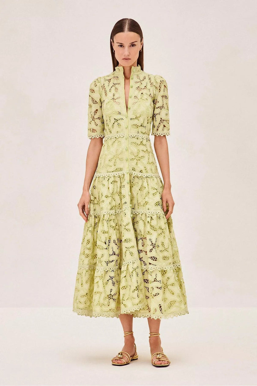 FJØRNA Ledina midi green dress featuring a flowing silhouette and elegant design, perfect for stylish occasions.